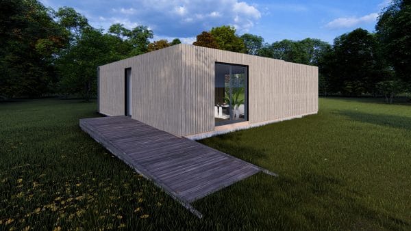 Module en bois moderne L'Eden PMR de 49,9m², avec bardage gris clair vertical et grande baie vitrée, posé dans un environnement naturel verdoyant.