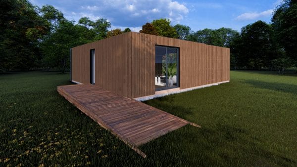 Module en bois moderne L'Eden PMR de 49,9 m², avec bardage bois marron, grande baie vitrée et terrasse en bois exotique, implanté dans un environnement verdoyant.