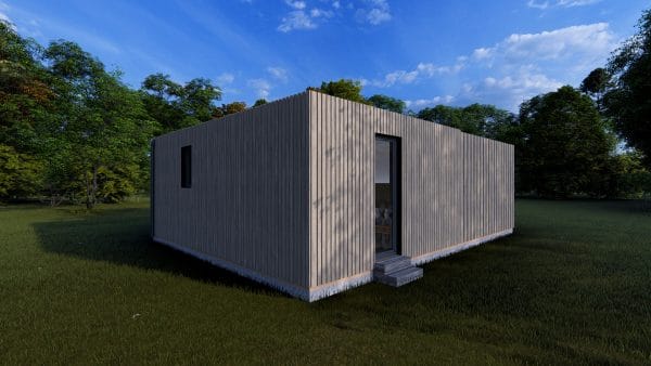Module d'habitation moderne Le Cosy 30,2 m2 en bois gris avec bardage vertical, posé dans un environnement verdoyant.