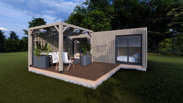 Module en bois moderne Le Cosy avec terrasse couverte et espace détente extérieur, posé dans un environnement verdoyant.