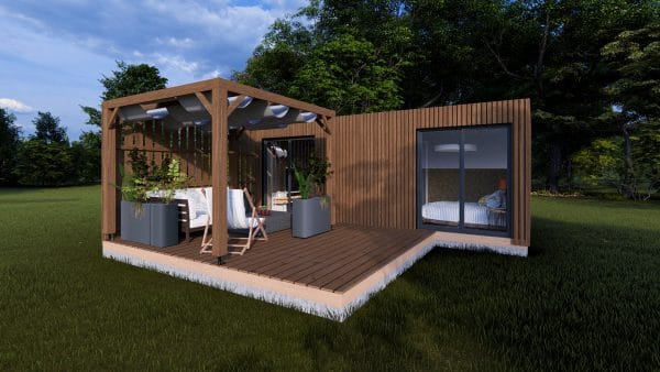 Module en bois moderne Le Cosy avec terrasse couverte et espace détente extérieur, installé dans un cadre verdoyant.
