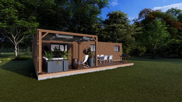 Module en bois moderne avec terrasse couverte intégrée, installé dans un environnement verdoyant et naturel.