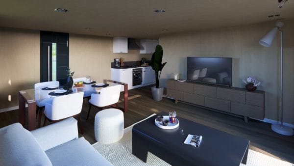 Intérieur moderne d'un module en bois avec espace de vie ouvert combinant salon, salle à manger et cuisine.