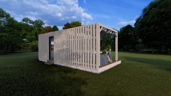 Module en bois contemporain "Le Nest" avec terrasse couverte, bardage à claire-voie et finition gris clair, installé dans un environnement verdoyant.