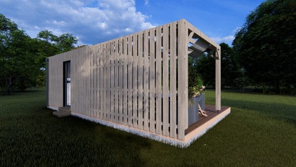 Module en bois moderne "Le Nest" avec façade à claire-voie et terrasse couverte, installé dans un environnement verdoyant.