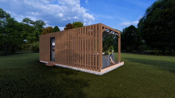 Module en bois contemporain "Le Nest" avec façade à claire-voie et terrasse couverte, installé dans un environnement verdoyant.
