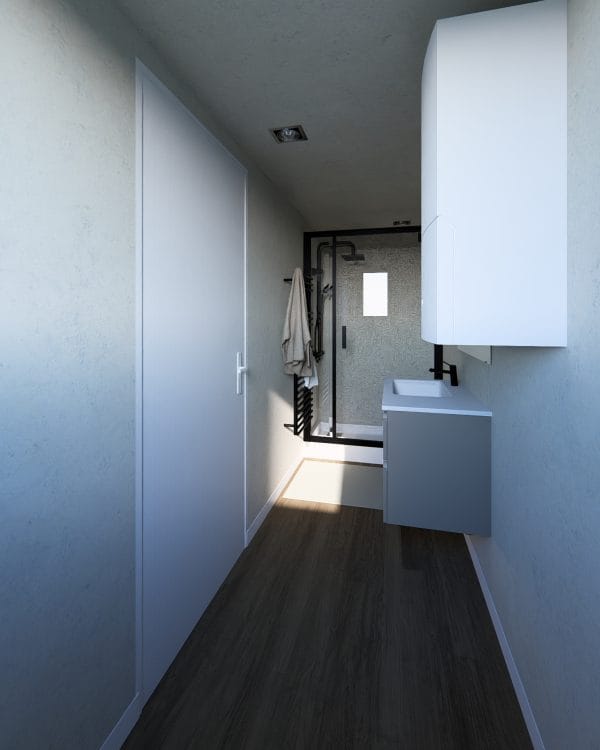 Couloir étroit d'une salle de bain moderne avec sol en bois foncé, murs blancs et meuble vasque suspendu.