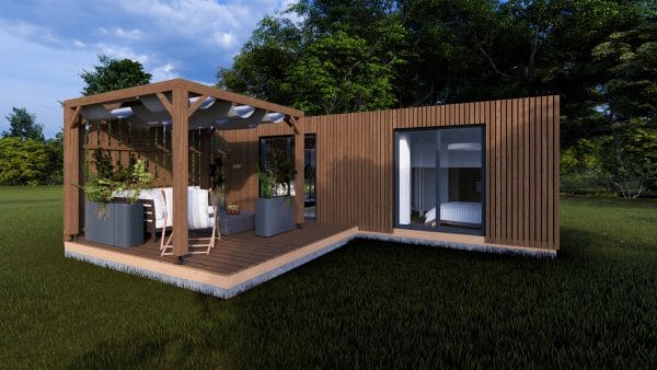 Module en bois moderne "L'Escapade" avec terrasse couverte et pergola, installé dans un cadre verdoyant.