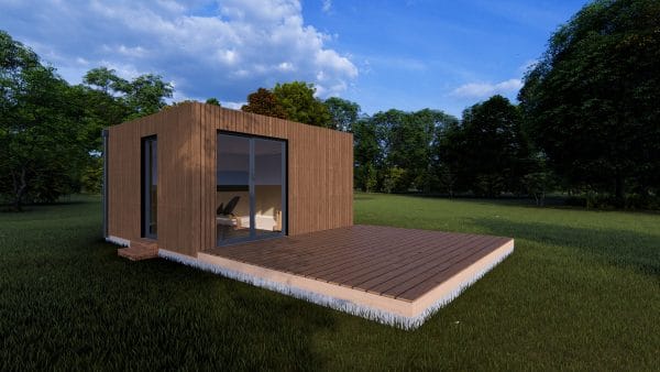 Module en bois moderne avec terrasse, situé dans un espace verdoyant et entouré d'arbres.