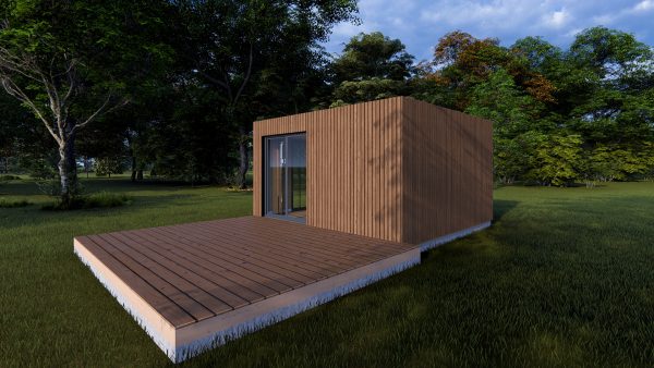 Module en bois moderne avec bardage vertical, posé au cœur d'un environnement naturel verdoyant, accompagné d'une terrasse en bois.