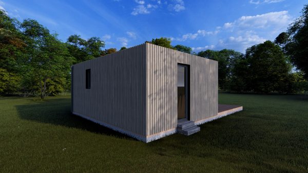 Module en bois rectangulaire, de couleur grise, avec une porte et une fenêtre, installé dans un environnement naturel verdoyant sous un ciel bleu.