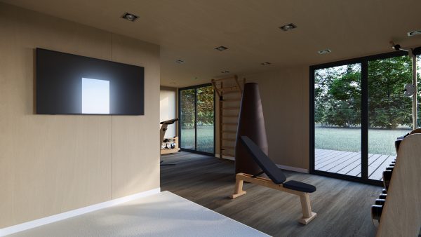 Salle de sport lumineuse et moderne aménagée dans un module en bois, avec de grandes baies vitrées donnant sur un espace extérieur verdoyant.