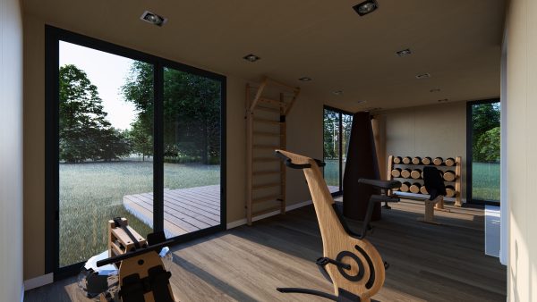 Salle de sport lumineuse et moderne aménagée dans un module en bois, avec équipements en bois et vue dégagée sur un jardin verdoyant grâce à de grandes baies vitrées.